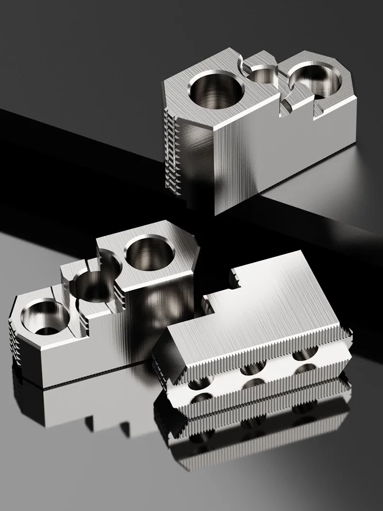 A set of three three-step hard jaws positioned in different orientations